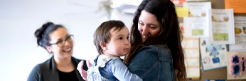 A child being held by it's mother