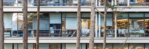 Exterior view of lab spaces with several trees in the foreground